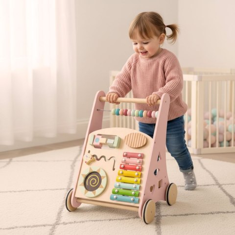 Pchacz dla dziecka chodzik drewniany z liczydłem różowy